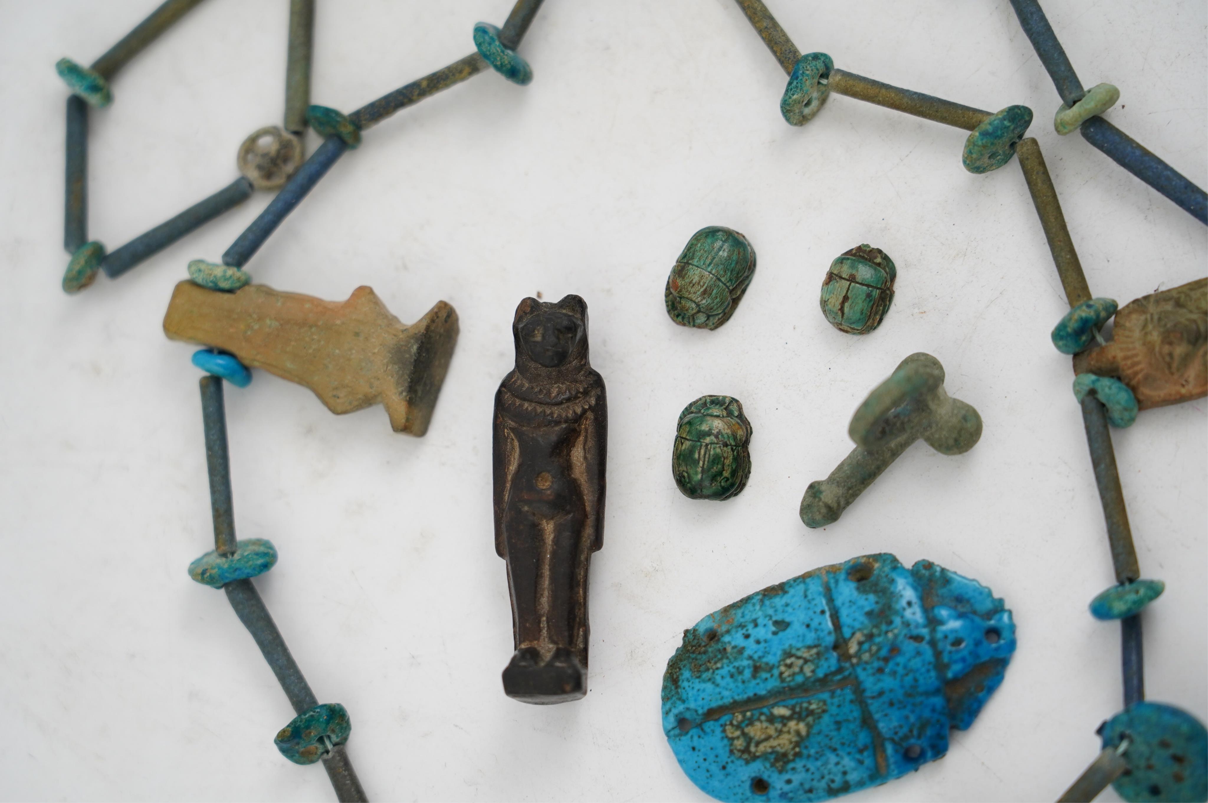 An ancient Egyptian faience necklace, amulets and scarabs, late Kingdom to Ptolemaic period